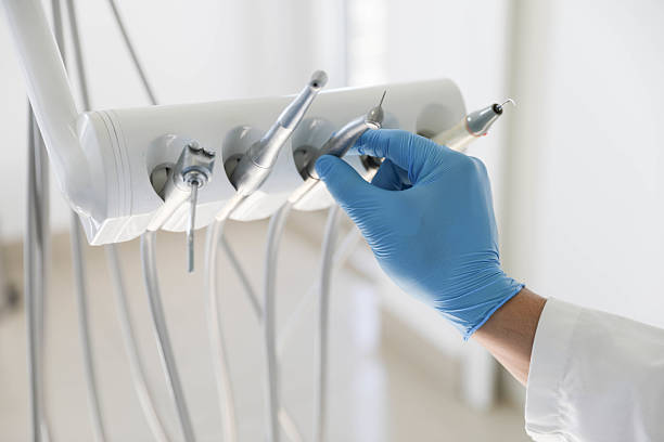 Professional Tooth Extraction technician working in Gautier, MS